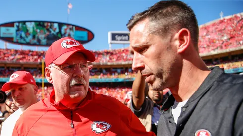 Head coach Andy Reid of the Kansas City Chiefs and head coach Kyle Shanahan of the San Francisco 49ers speak after the game at midfield at Arrowhead Stadium on September 23rd, 2018 in Kansas City, Missouri.