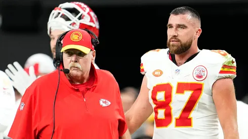 Andy Reid and Travis Kelce look on during a game against the Raiders.