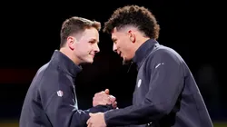 Brock Purdy of the San Francisco 49ers (L) and Patrick Mahomes of the Kansas City Chiefs meet on stage during Super Bowl LVIII Opening Night at Allegiant Stadium on February 05, 2024 in Las Vegas, Nevada.