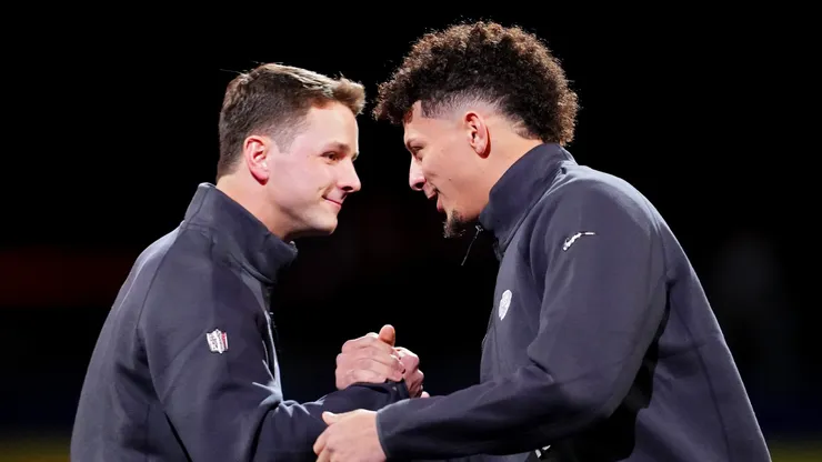 Brock Purdy of the San Francisco 49ers (L) and Patrick Mahomes of the Kansas City Chiefs meet on stage during Super Bowl LVIII Opening Night at Allegiant Stadium on February 05, 2024 in Las Vegas, Nevada.
