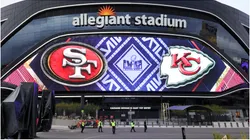 A video board displays logos for Super Bowl LVIII at Allegiant Stadium