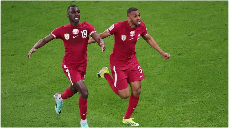 Almoez Ali of Qatar celebrates scoring their third goal with Abdulaziz Hatem