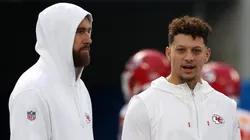 Travis Kelce #87 and Patrick Mahomes #15 of the Kansas City Chiefs speak before a game against the Los Angeles Chargers at SoFi Stadium on January 07, 2024 in Inglewood, California.