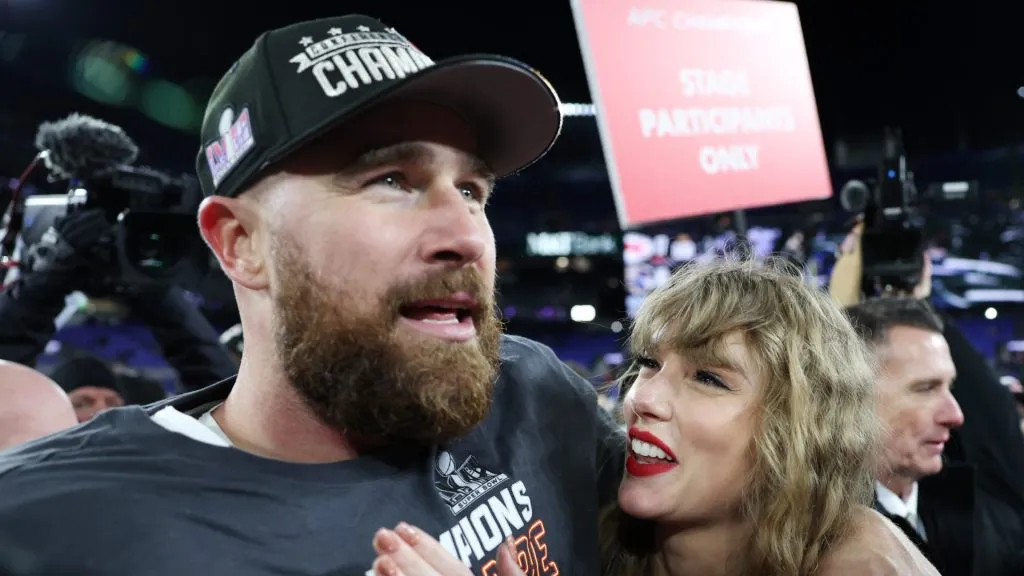 Travis Kelce #87 of the Kansas City Chiefs celebrates with Taylor Swift after a 17-10 victory against the Baltimore Ravens in the AFC Championship Game at M&T Bank Stadium on January 28, 2024 in Baltimore, Maryland.