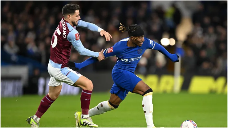 Noni Madueke of Chelsea is grabbed by Alex Moreno of Aston Villa