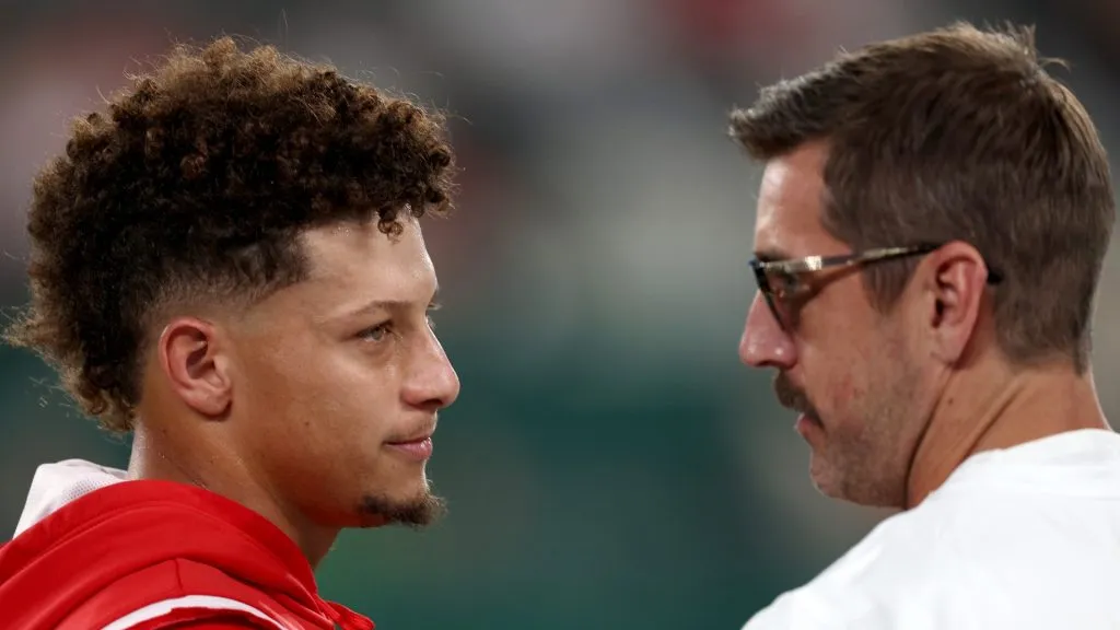 Patrick Mahomes #15 of the Kansas City Chiefs talks with injured Aaron Rodgers #8 of the New York Jets prior to the game at MetLife Stadium on October 01, 2023 in East Rutherford, New Jersey.