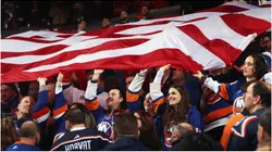 Fans wave the American flag