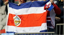 Costa Rican fans hold their contry's flag