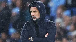 Man City coach Pep Guardiola looks on during a game.