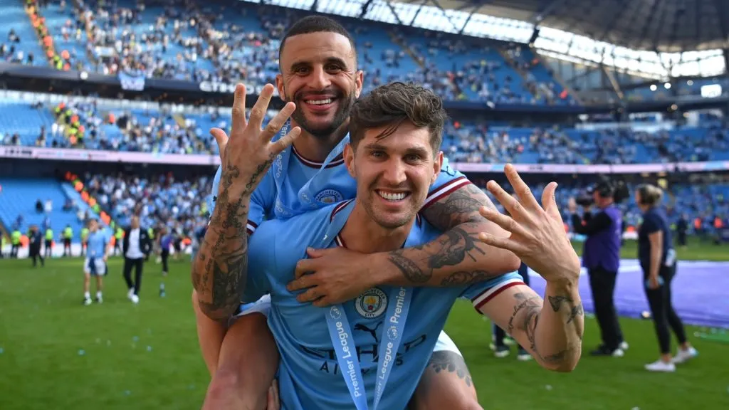 John Stones of Manchester City celebrates with Kyle Walker