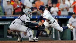 Mauricio Dubon #14 of the Houston Astros is out at the plate in the ninth inning against Jose Trevino #39 of the New York Yankees on Opening Day at Minute Maid Park on March 28, 2024 in Houston, Texas.