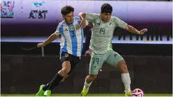 Roman Vega (L) of Argentina dights for the ball with Diego Medina (R) of Mexico