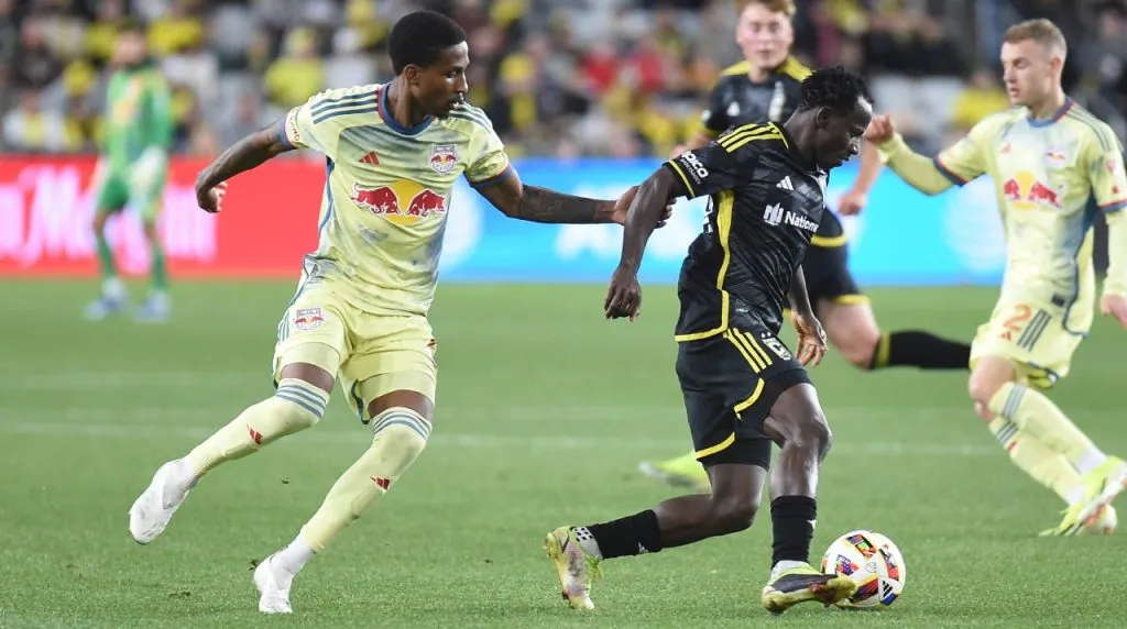 Columbus Crew midfielder Yaw Yeboah (14) handles the ball against New York Red Bulls defender Kyle Duncan (6) in their match in Columbus, Ohio.