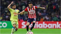 Henry Martin (L) of America fights for the ball with Jesus Orozco (R) of Guadalajara