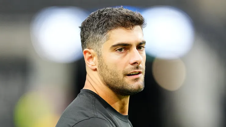 Jimmy Garoppolo looks on during warmup.