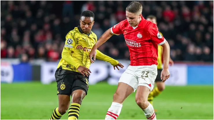 Youssoufa Moukoko of Borussia Dortmund in duel against Joey Veerman of PSV Eindhoven