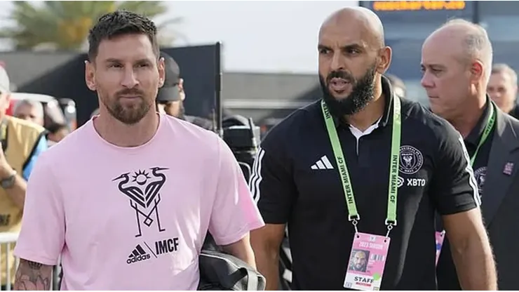 Yassine Chueko and Lionel Messi
