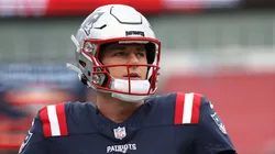 Mac Jones #10 of the New England Patriots looks on before the game against the Kansas City Chiefs at Gillette Stadium on December 17, 2023 in Foxborough, Massachusetts.