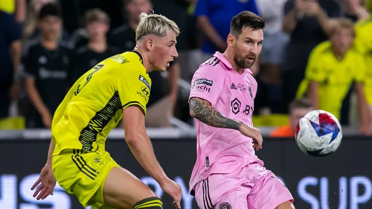 Inter Miami forward Lionel Messi (10) crosses the ball ahead of Nashville SC defender Lukas MacNaughton (3) during the Leagues Cup Final match between Nashville SC and Inter Miami CF on Saturday, August 19, 2023 at GEODIS Park in Nashville, TN.