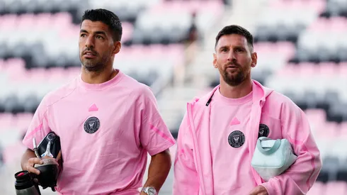 Luis Suárez #9 and Lionel Messi #10 of Inter Miami CF arrive before a friendly match against Newell's Old Boys at DRV PNK Stadium on February 15, 2024 in Fort Lauderdale, Florida.