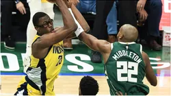 Jalen Smith (L) of Indiana Pacers vies with Khris Middleton of Milwaukee Bucks