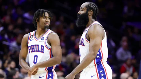 Tyrese Maxey #0 and James Harden #1 of the Philadelphia 76ers look on during the fourth quarter against the Cleveland Cavaliers at Wells Fargo Center on February 15, 2023 in Philadelphia, Pennsylvania.