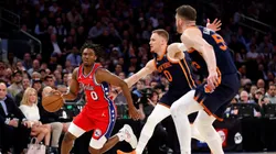 Tyrese Maxey #0 of the Philadelphia 76ers dribbles as Donte DiVincenzo #0 and Isaiah Hartenstein #55 of the New York Knicks defend during the first half in Game Two of the Eastern Conference First Round Playoffs at Madison Square Garden on April 22, 2024 in New York City.