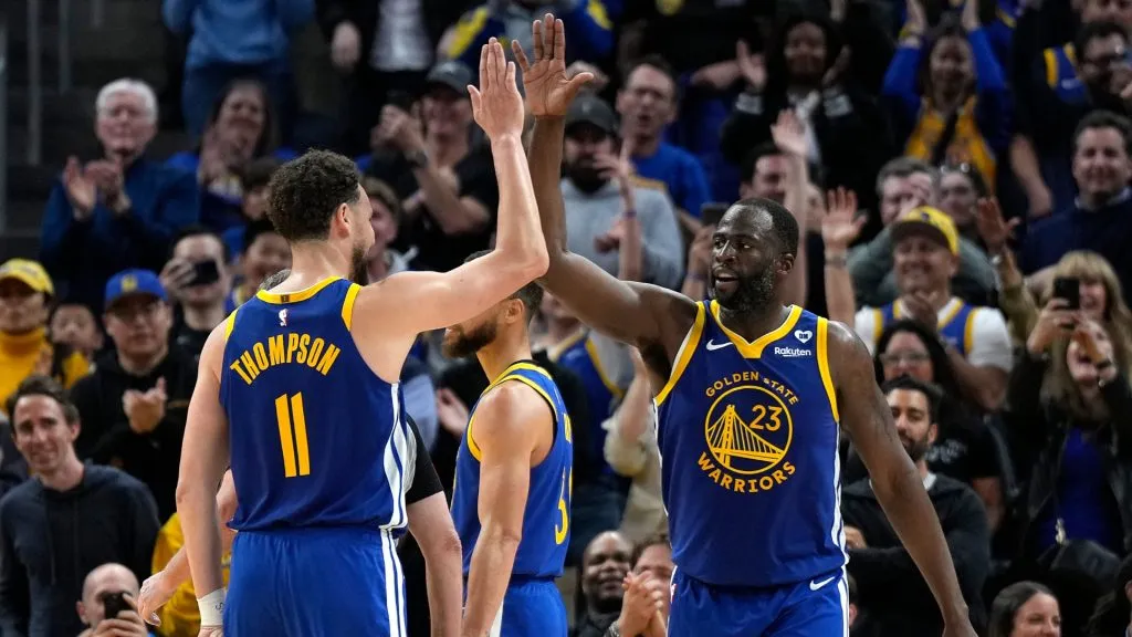 Draymond Green #23 of the Golden State Warriors celebrates with Klay Thompson #11 after scoring against the Dallas Mavericks late in the second half at Chase Center on April 02, 2024 in San Francisco, California.