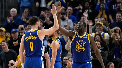 Draymond Green #23 of the Golden State Warriors celebrates with Klay Thompson #11 after scoring against the Dallas Mavericks late in the second half at Chase Center on April 02, 2024 in San Francisco, California.