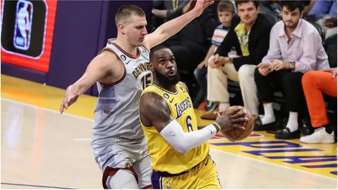 Los Angeles Lakers forward LeBron James gets past Denver Nuggets center Nikola Jokic