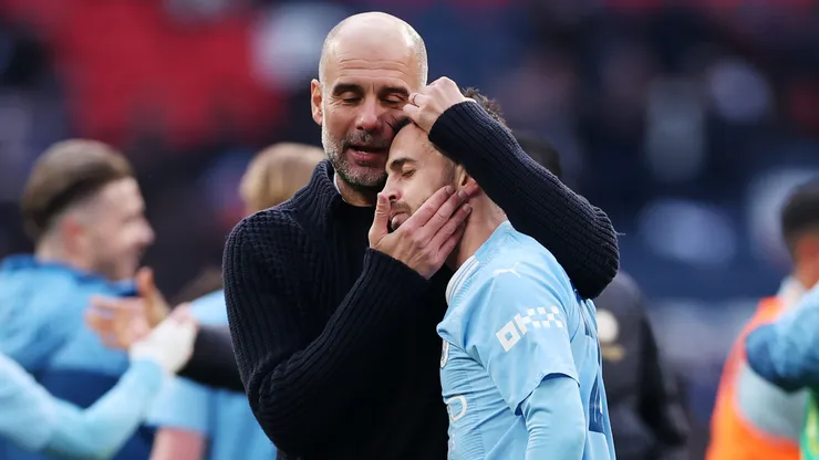 Pep Guardiola and Bernardo Silva of Manchester City