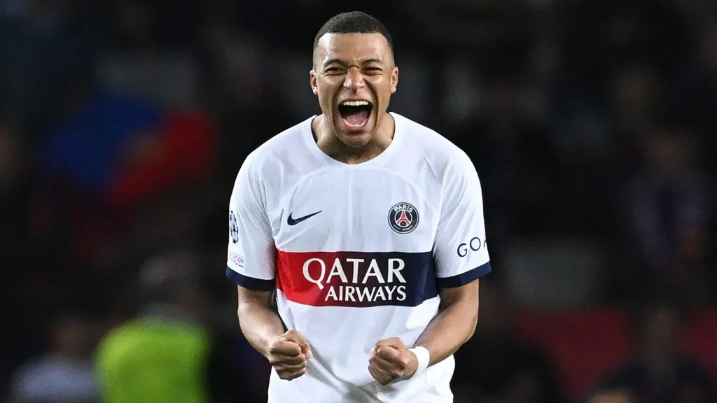Kylian Mbappe of Paris Saint-Germain celebrates victory in the UEFA Champions League quarter-final second leg match between FC Barcelona and Paris Saint-Germain at Estadi Olimpic Lluis Companys on April 16, 2024 in Barcelona, Spain.