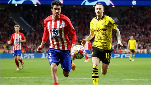 Jose Gimenez of Atletico de Madrid and Marco Reus of Borussia Dortmund