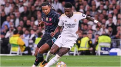 Vinicius of Real Madrid and Akanji of Manchester City