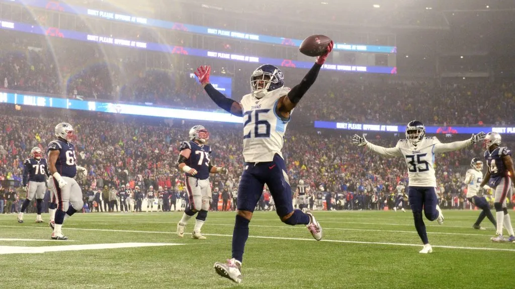 Logan Ryan #26 of the Tennessee Titans celebrates his touchdown against the New England Patriots in the fourth quarter of the AFC Wild Card Playoff game at Gillette Stadium on January 04, 2020 in Foxborough, Massachusetts.