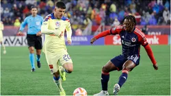 New England Revolution midfielder DeJuan Jones moves in on Club America midfielder Richard Sanchez
