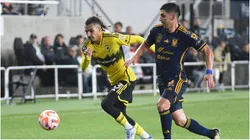 Columbus Crew defender Mohamed Farsi handles the ball against Tigres UANL defender Jesus Angulo