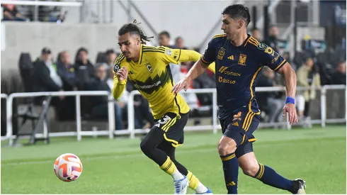 Columbus Crew defender Mohamed Farsi handles the ball against Tigres UANL defender Jesus Angulo