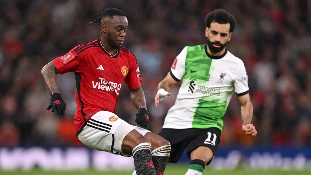 Mohamed Salah of Liverpool challenges Aaron Wan-Bissaka of Manchester United during the Emirates FA Cup Quarter Final match between Manchester United and Liverpool at Old Trafford on March 17, 2024 in Manchester, England.