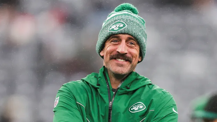 Aaron Rodgers shares a laugh with one of his teammates during warm-ups at Met Life Stadium.
