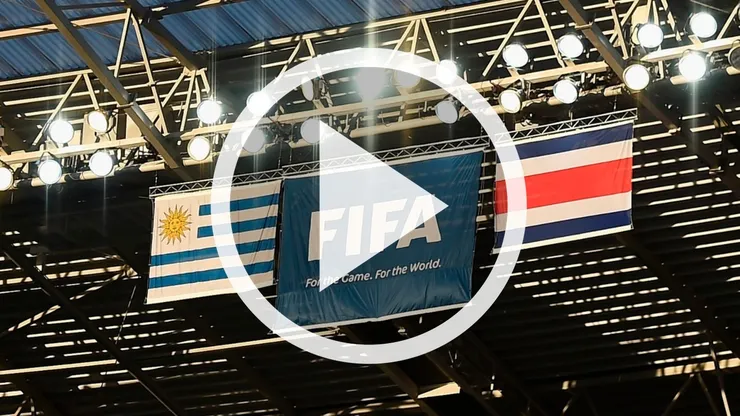 Flags of Uruguay (L) and Costa Rica are displayed next to a flag showing the FIFA logo above the stands during the 2014 FIFA World Cup Brazil Group D match between Uruguay and Costa Rica at Castelao on June 14, 2014 in Fortaleza, Brazil.