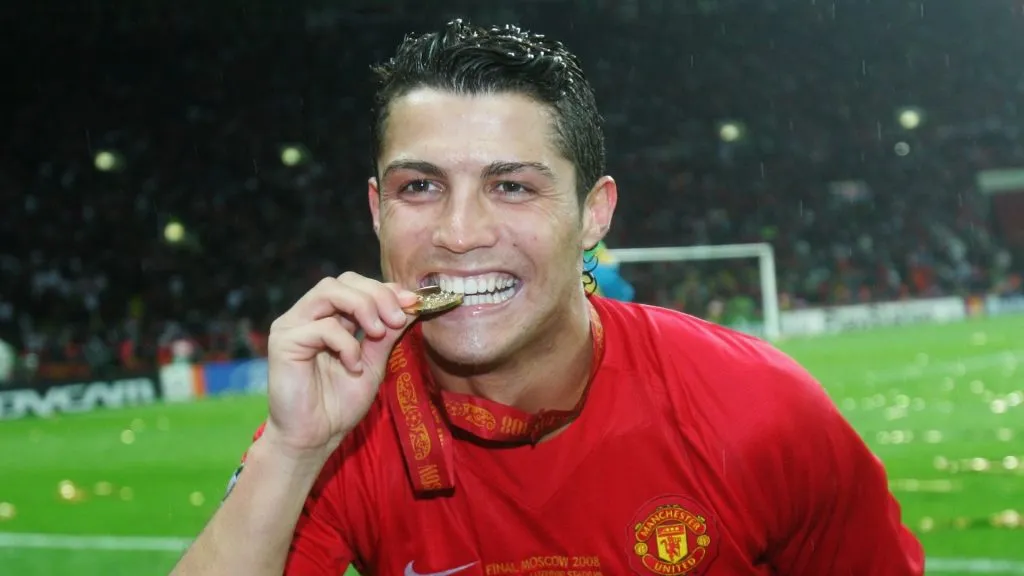 Cristiano Ronaldo of Manchester United bites his winners medal following his team's victory during the UEFA Champions League Final match between Manchester United and Chelsea at the Luzhniki Stadium on May 21, 2008 in Moscow, Russia.