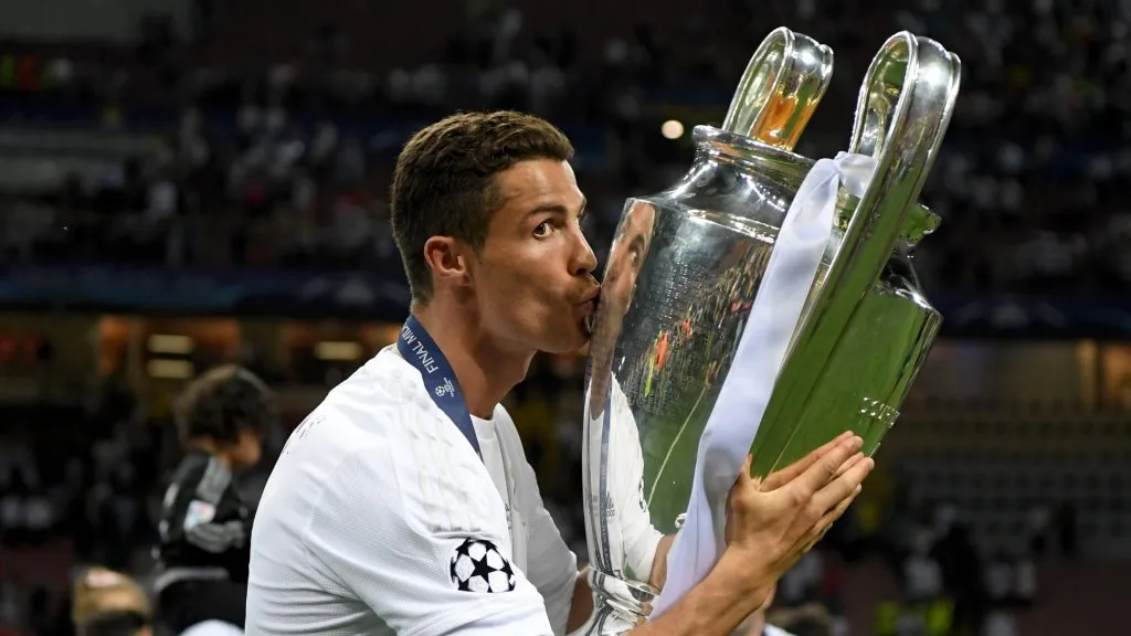 Cristiano Ronaldo of Real Madrid kisses the trophy after winning the UEFA Champions League Final match between Real Madrid and Club Atletico de Madrid at Stadio Giuseppe Meazza on May 28, 2016 in Milan, Italy.
