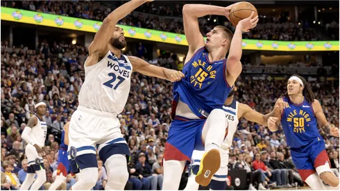 Rudy Gobert (27) of the Minnesota Timberwolves defends Nikola Jokic (25) of the Denver Nuggets