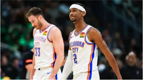 Oklahoma City Thunder's Gordon Hayward (L) and Shai Gilgeous-Alexander