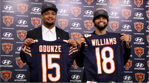 Chicago Bears rookies Rome Odunze and Caleb Williams holding their jerseys