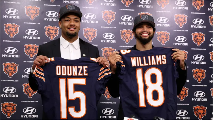 Chicago Bears rookies Rome Odunze and Caleb Williams holding their jerseys
