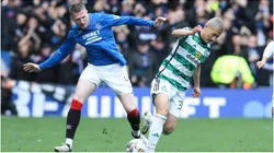 Daizen Maeda of Celtic vies with John Lundstram of Rangers