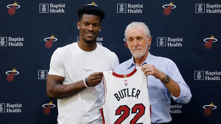 Jimmy Butler poses for a photo with Miami Heat president Pat Riley in 2019.