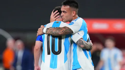 Lautaro Martinez of Argentina hugs Lionel Messi during the CONMEBOL Copa America 2024 match between Chile and Argentina